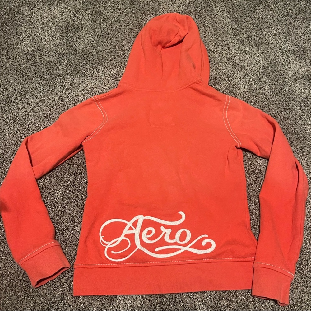 Medium 2000’s orange Aeropostale Zip up jacket with hood and white stitching.